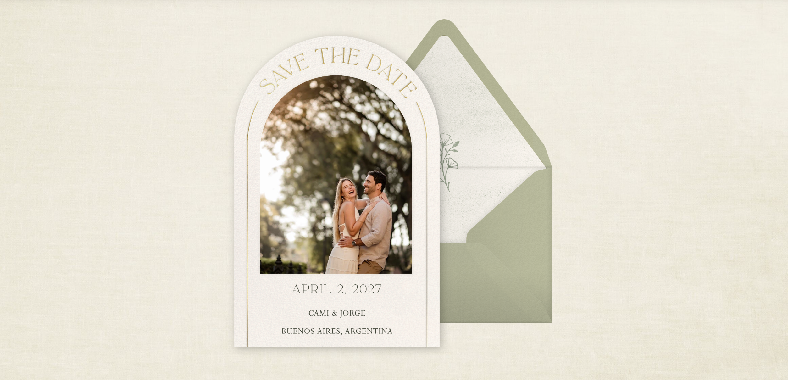 Our original Save the Date: an arched ivory card, sage envelope, and linen background. Cami and Jorge, April 2, 2027, Buenos Aires, Argentina.